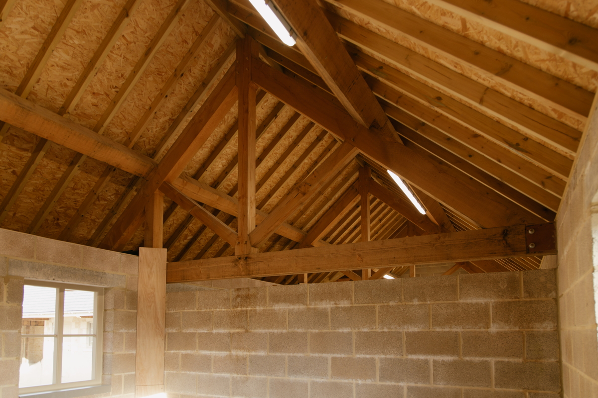 Interior of renovated barn showing exposed beams and structural elements