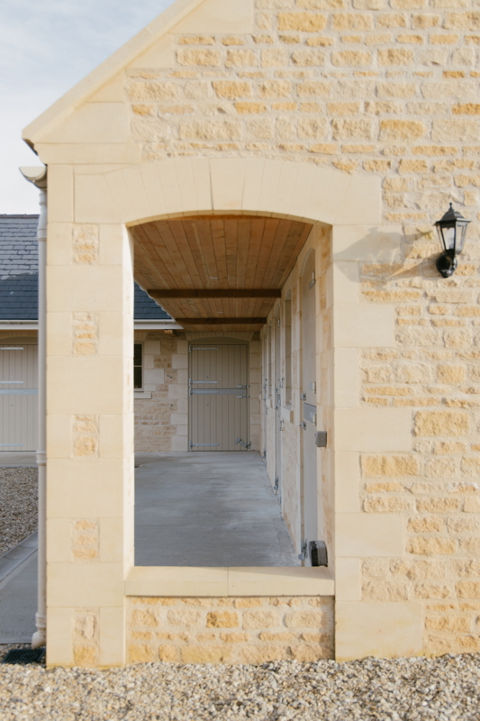 Exterior view of restored listed farm building with traditional stonework
