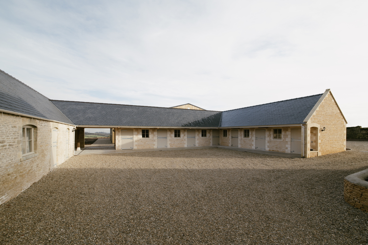 Exterior view of restored listed farm building with stables