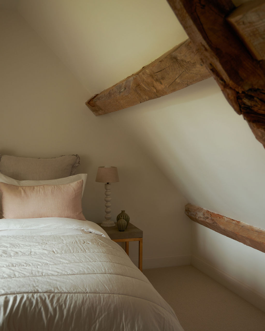 Interior view of bedroom area showing exposed beams