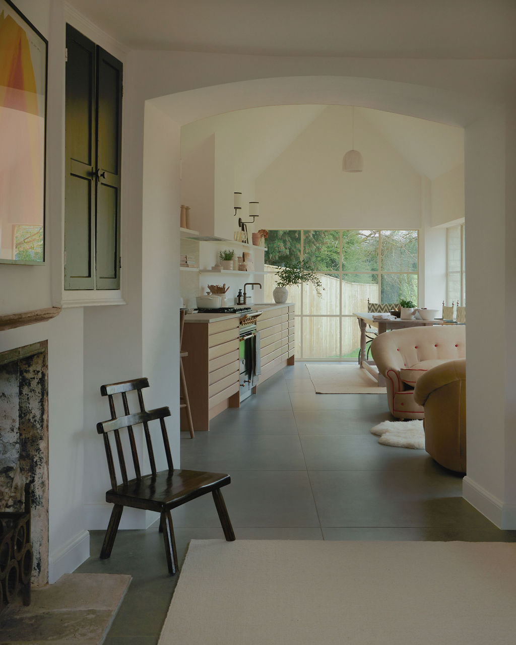 Interior view into kitchen from dining room, showing spacious layout