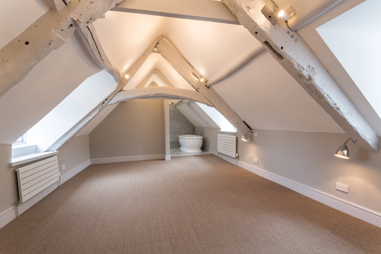 Interior view of roof space room with exposed beams