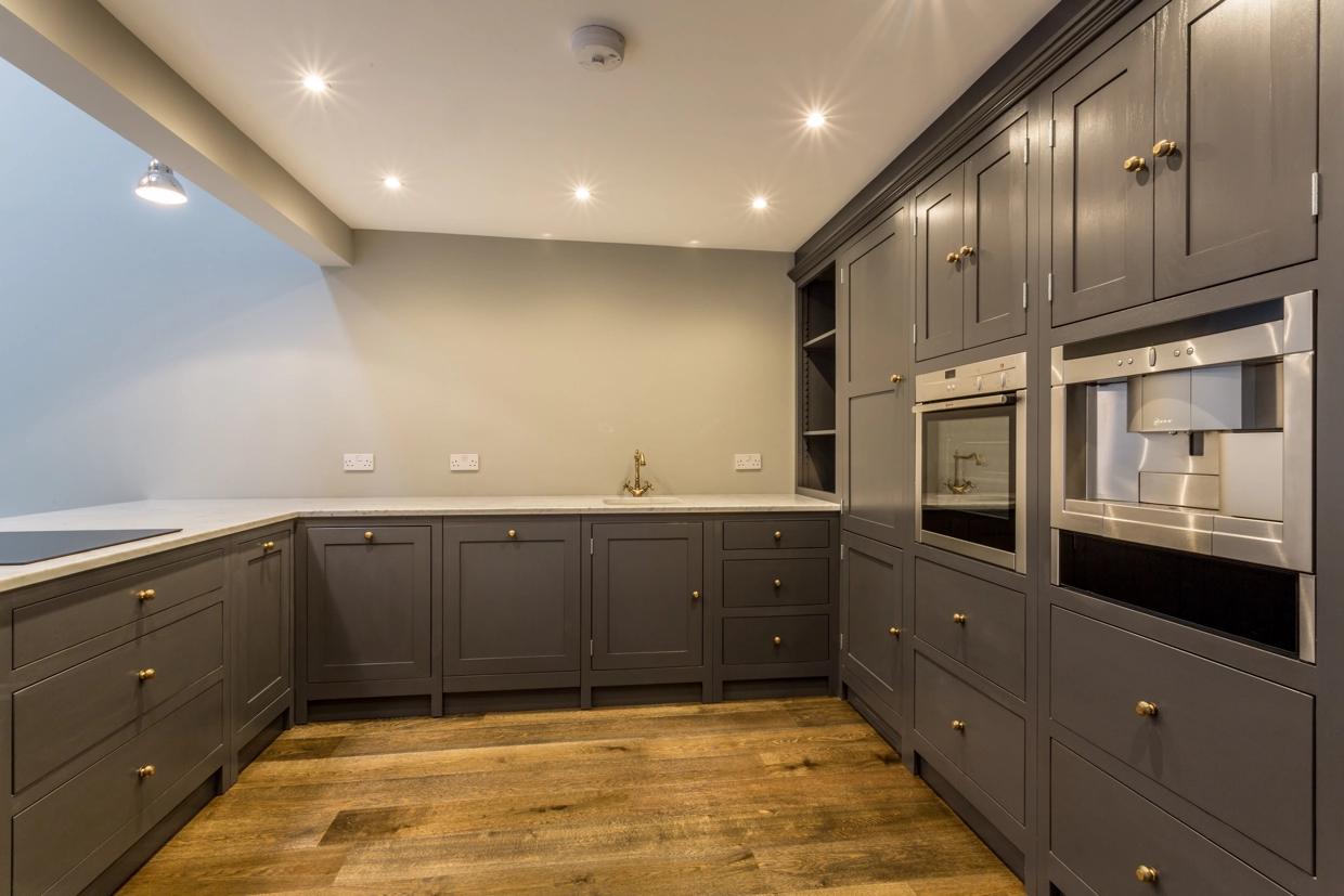 Modern cupboards and appliances in the renovated kitchen