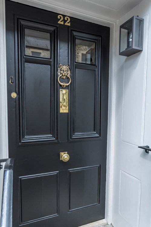 Exterior view of renovated traditional wooden front door