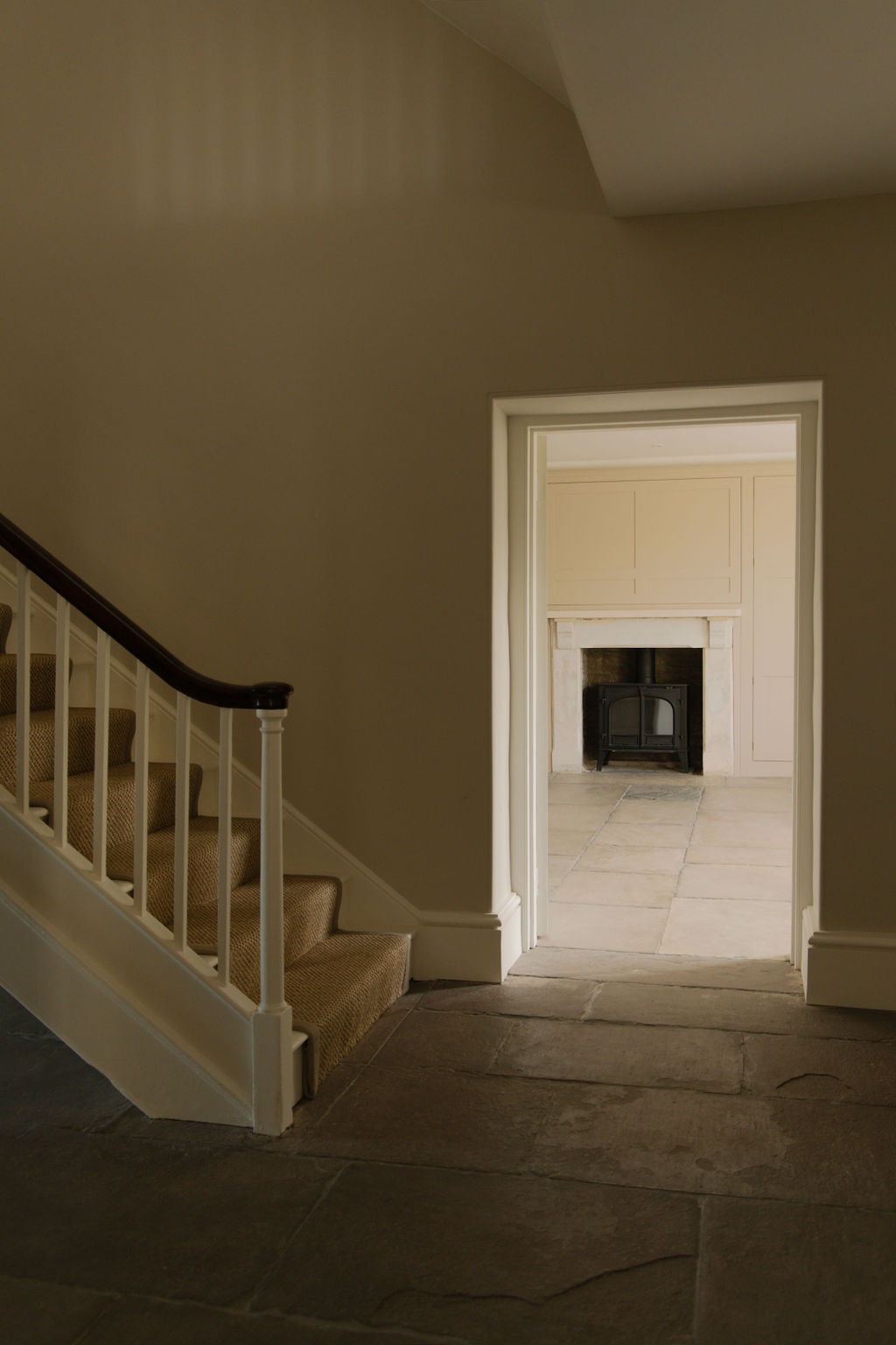 Interior hallway view showing York stone flooring and staircase