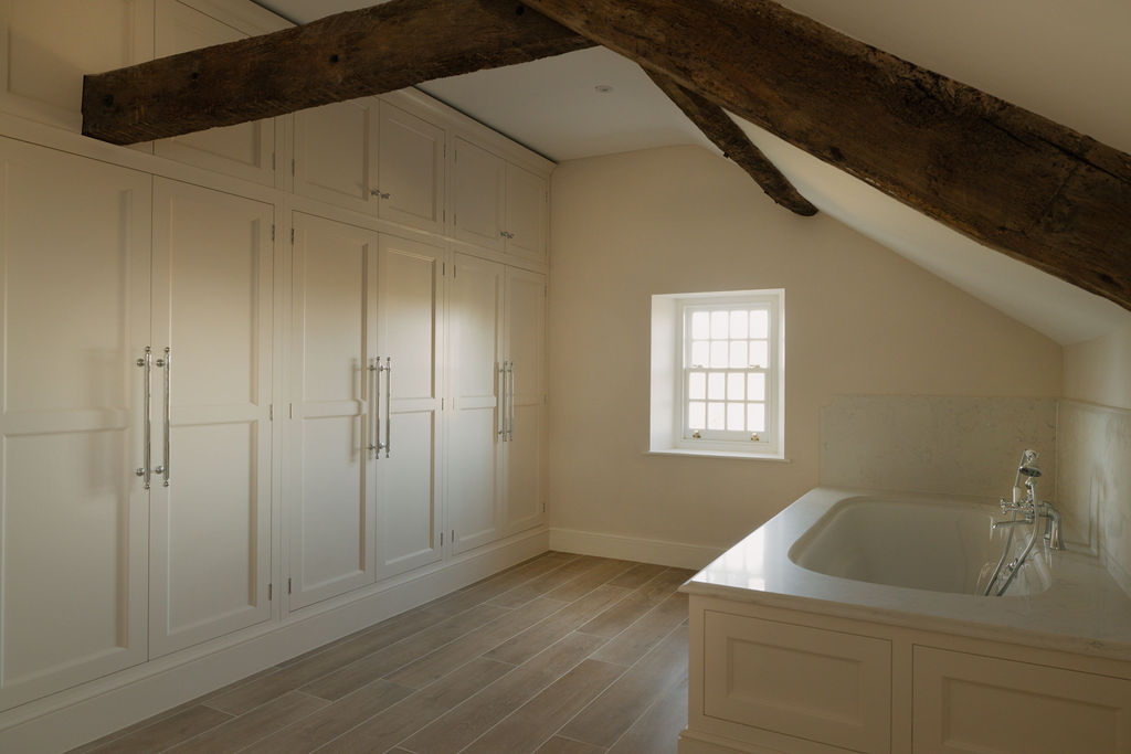 Bathroom view showcasing exposed beams and restoration craftsmanship