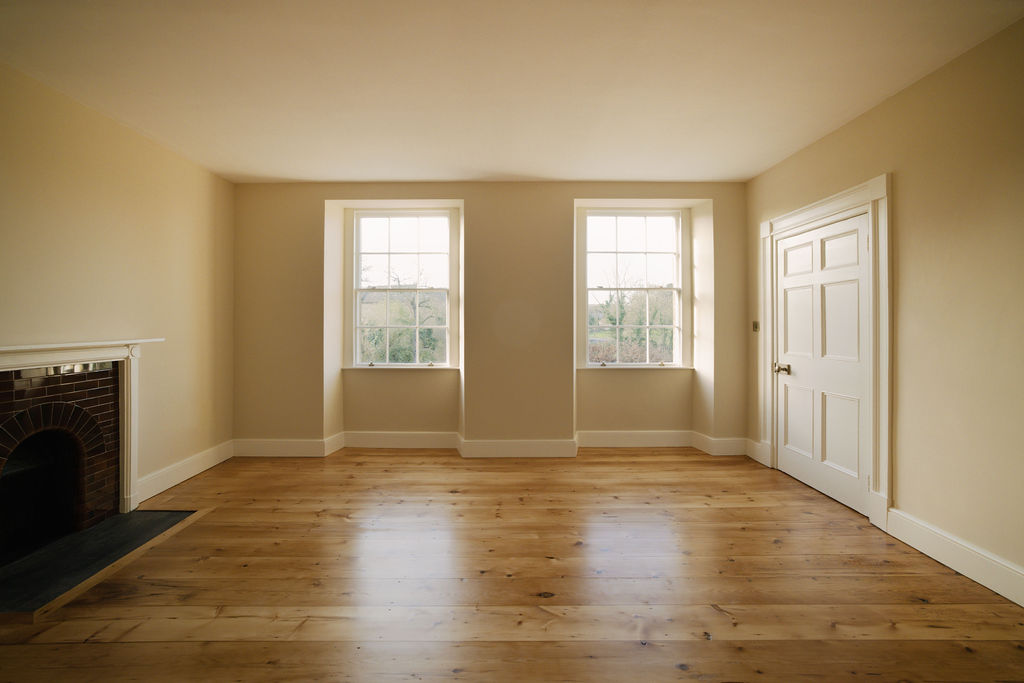 Living room with restored fireplace and wooden floor