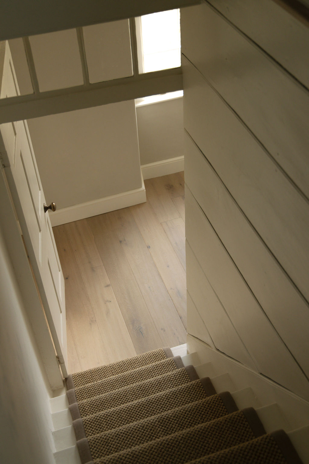 Detail of restored staircase and wood flooring