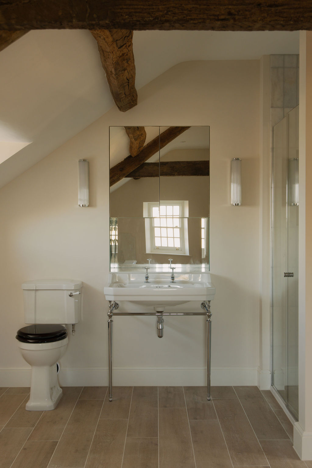 Bathroom featuring traditional fixtures with modern amenities