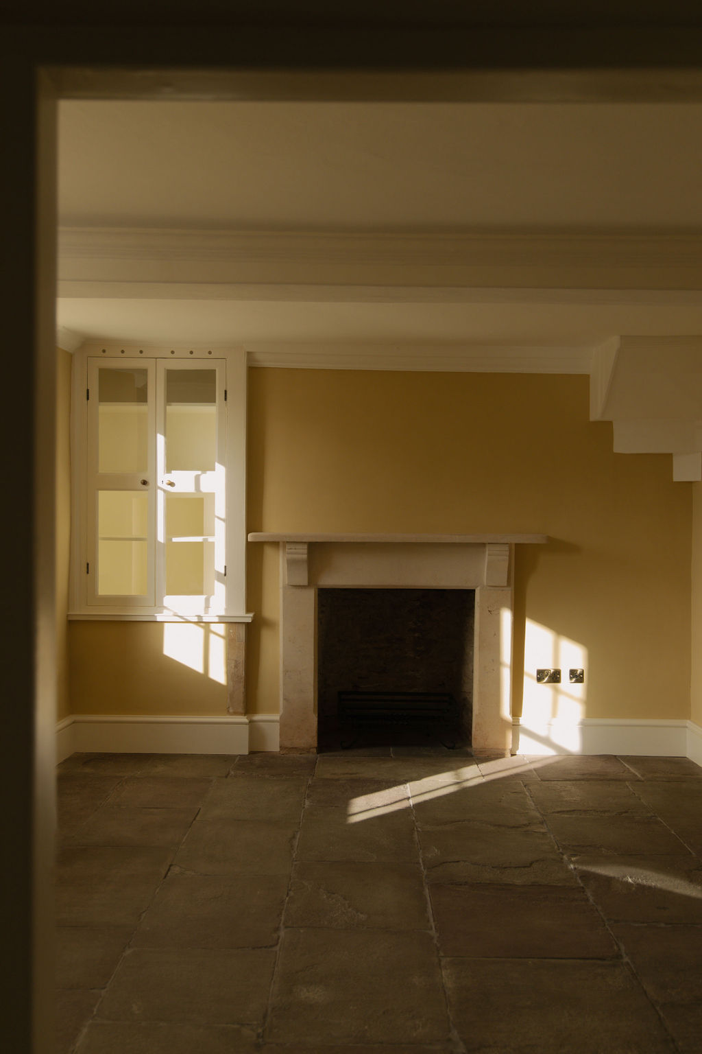 Living area view showing York stone flooring and fireplace