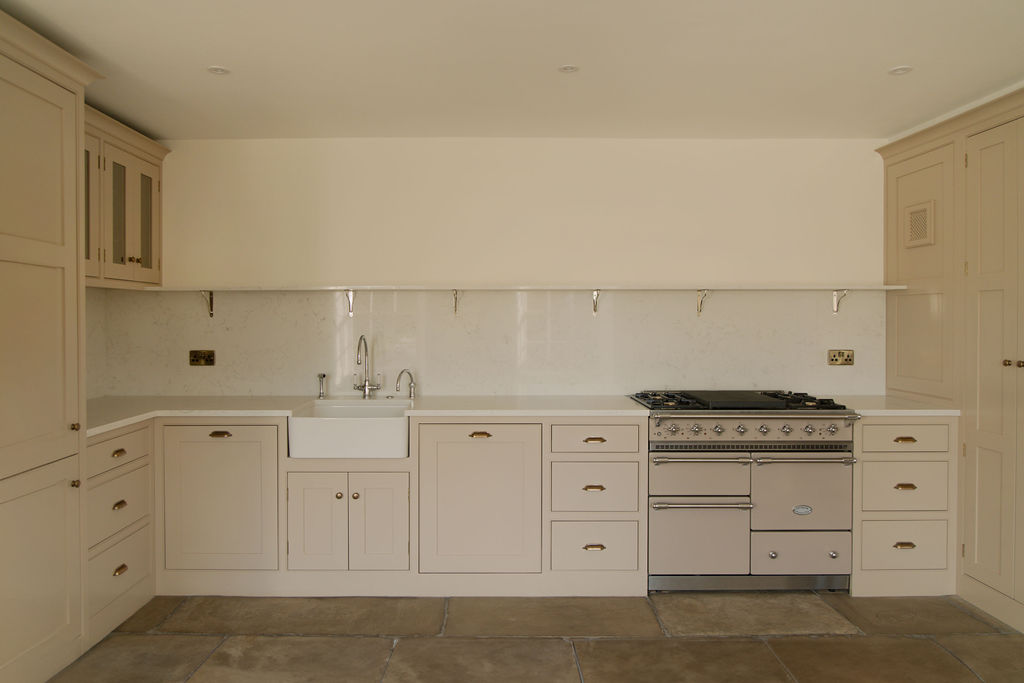 Kitchen area with custom cabinetry and modern appliances