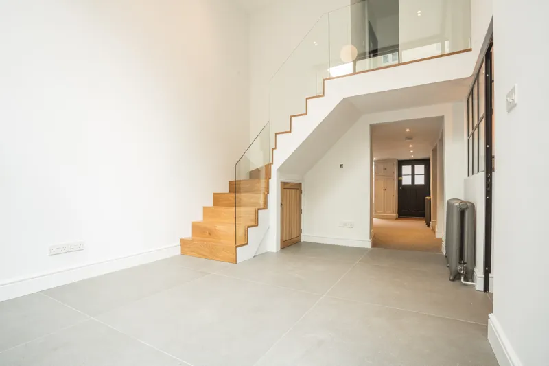 Interior view from ground floor, showing modern stairs up to first floor