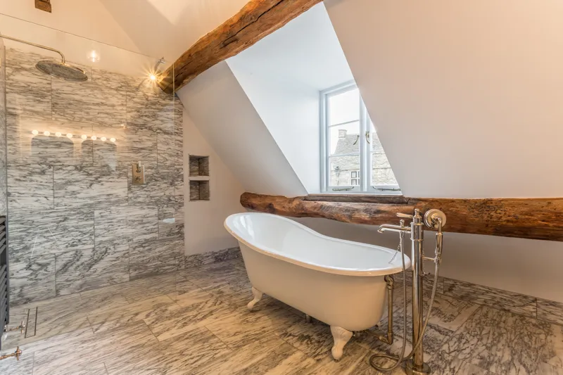 Wet room bathroom with exposed beams