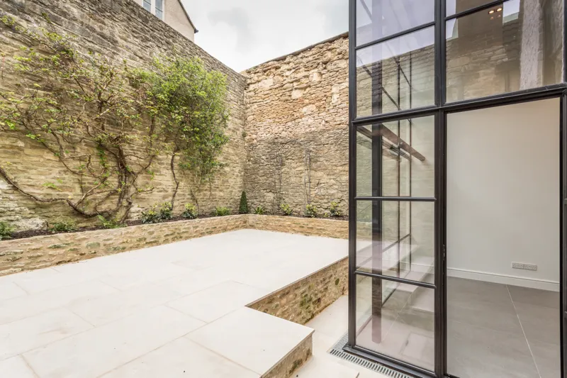 Exterior view of the courtyard garden area, showing new two storey extension